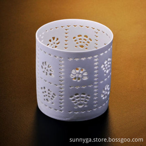 Ceramic tea-light candle holder with sand blast hollow out pattern